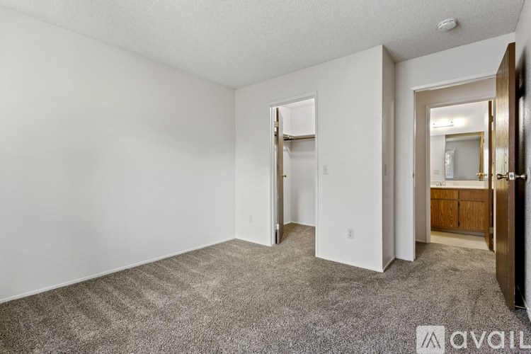A room with a carpeted floor and white walls.