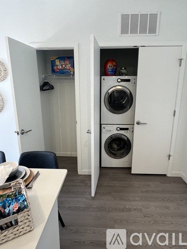 A laundry room with a washer and dryer in it.
