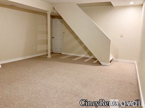 A room with a staircase leading to the second floor.