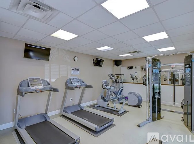 A gym with treadmills and exercise equipment.