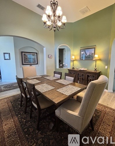 A kitchen with a granite countertop and a plate of fruit on it.