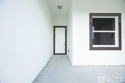 A room with a door and a window.