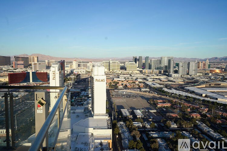 A cityscape with the word "PALMS" prominently displayed on a building.