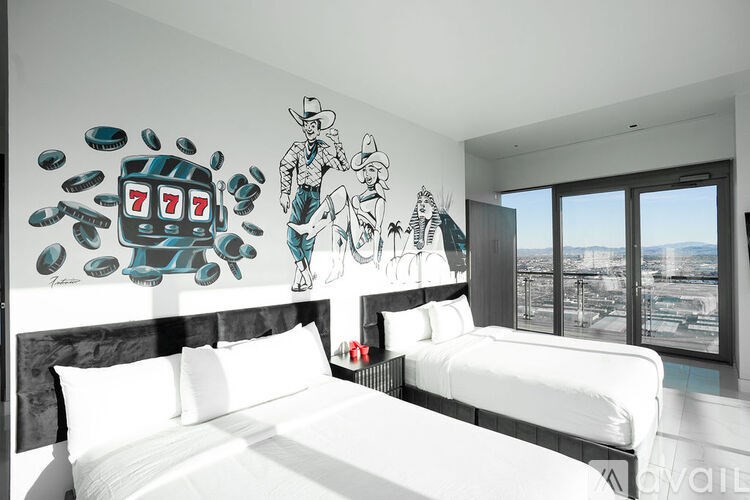 A room with two beds and a wall mural of a cowboy and slot machines.