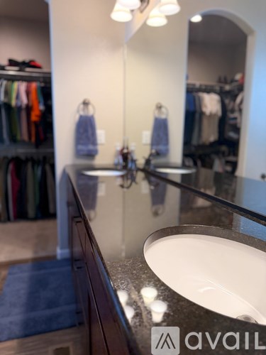 A bathroom with a sink and a mirror.