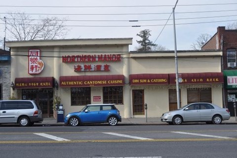 A Chinese restaurant named Northern Manor is located on a street corner with cars parked in front.