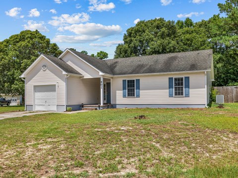 A house with a garage and a driveway.