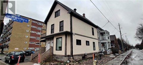 A house with a car parked in front of it.