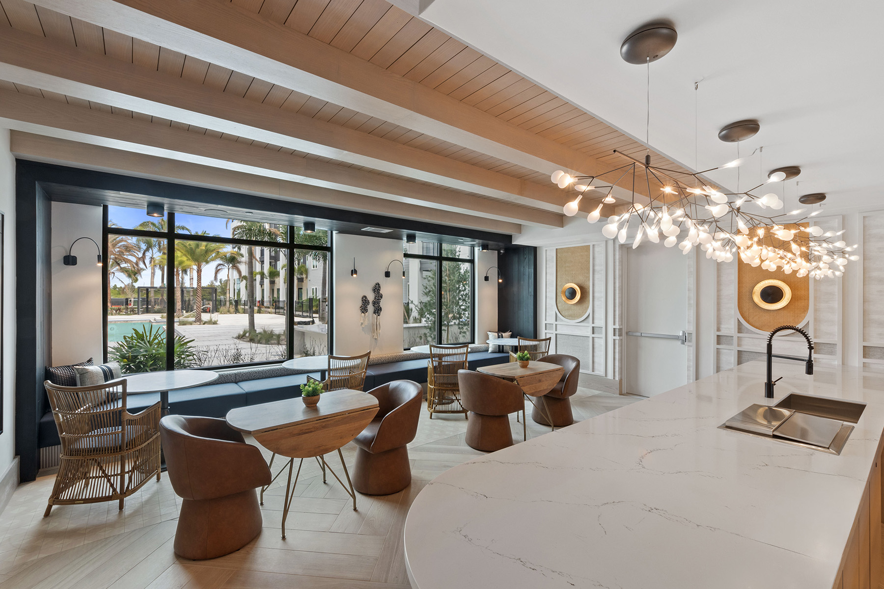 A modern kitchen with a dining table and chairs.