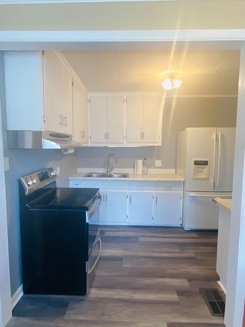 A black dishwasher is in a white kitchen.