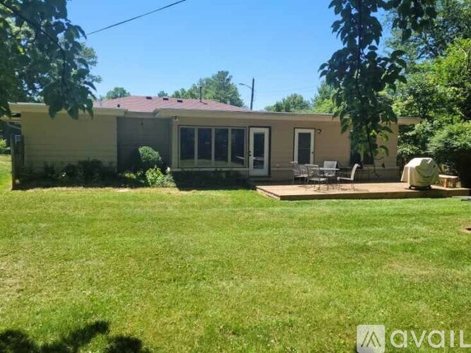 A house with a lawn in front of it.