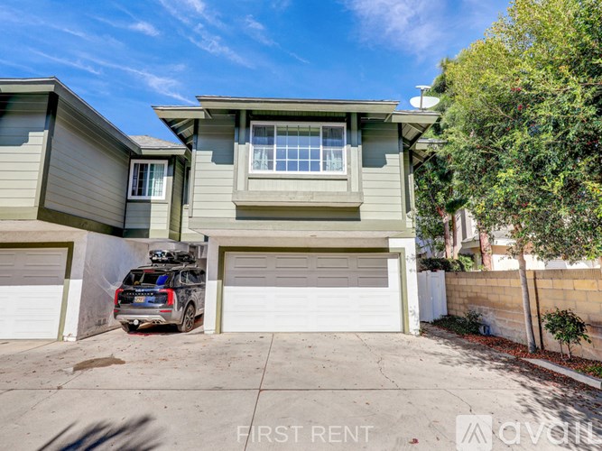 A house with a garage is for rent.
