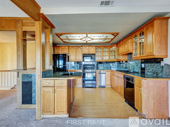 A room with a window and a door leading to another room.