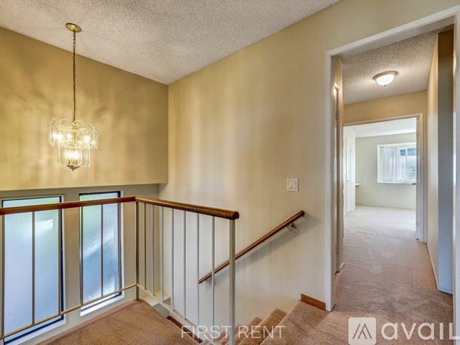 A room with a window and a door is available for rent.