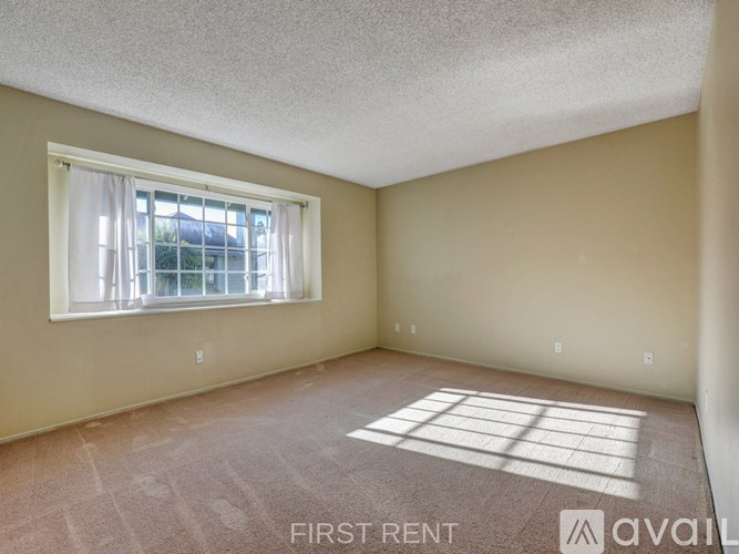 A room with a doorway leading to another room.