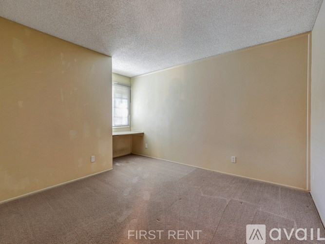 A balcony overlooks a lush green landscape.