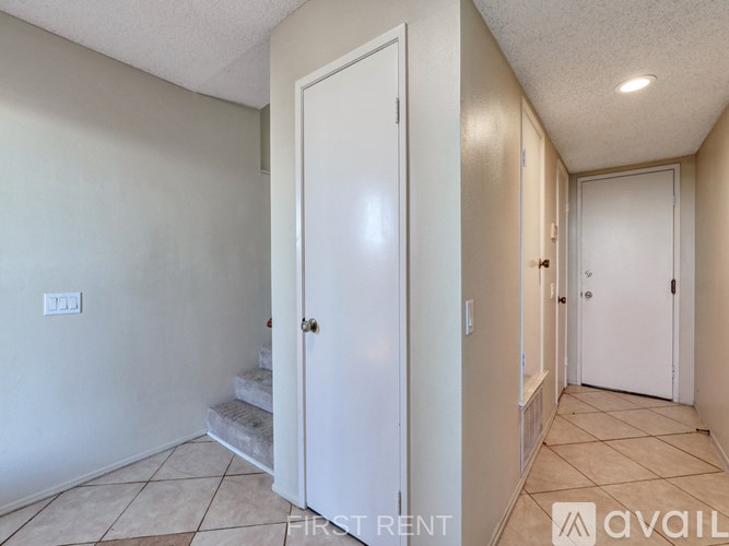 A row of garages with the words "First Rent" on the bottom.