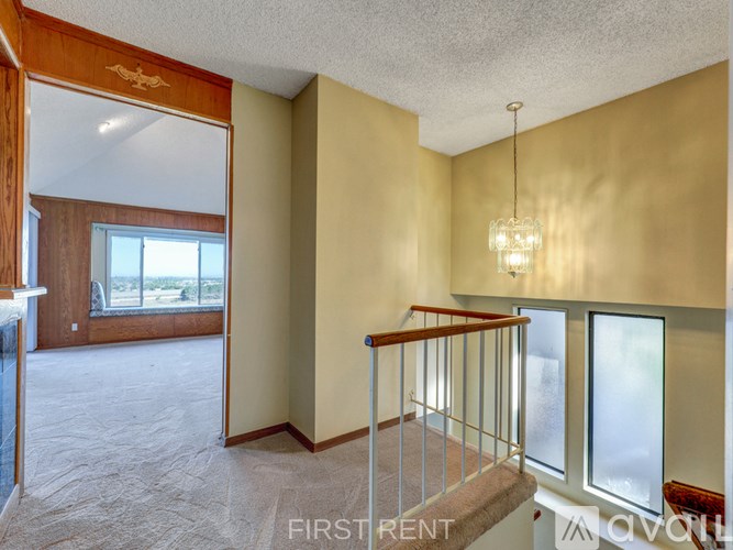 A balcony with a view of a field.