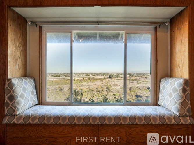 A kitchen with wooden cabinets and a black countertop.