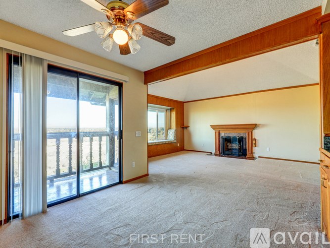 A kitchen with wooden cabinets and black appliances.