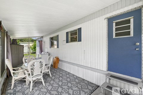 A patio with a table and chairs is shown.