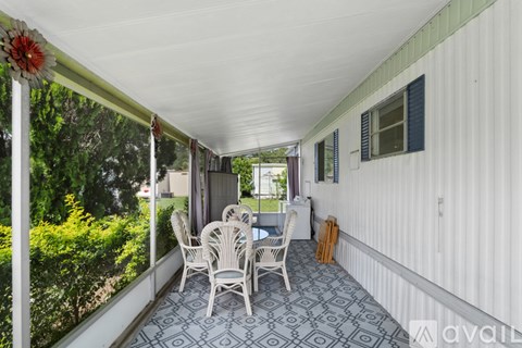 A patio with a table and chairs is shown.