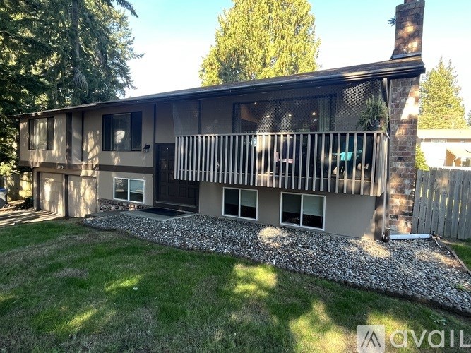 A house with a balcony and a chimney is for sale.