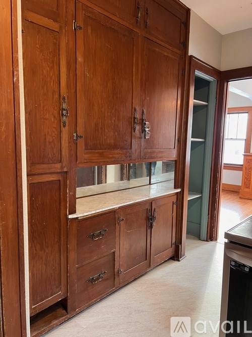 A kitchen with wooden cabinets and a countertop.