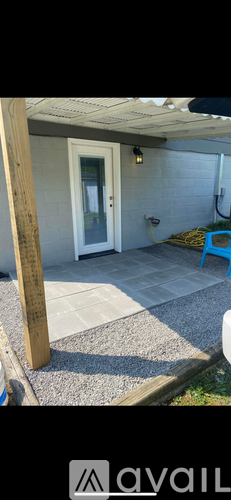A patio area with a door and a table.