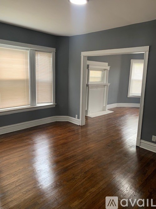 A room with wooden floors and a white door.