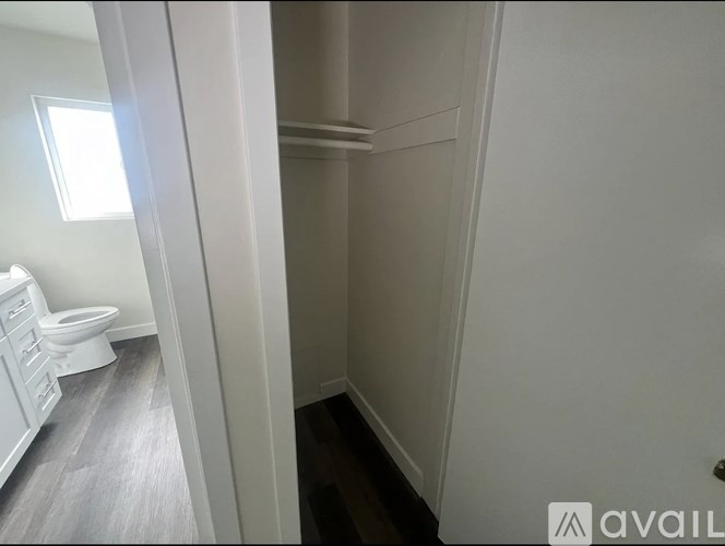 A bathroom with a toilet and a sink.