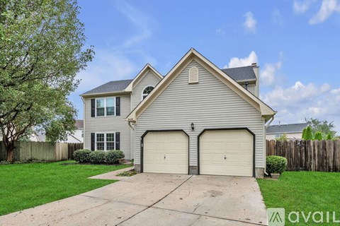 A two-car garage is attached to a house.