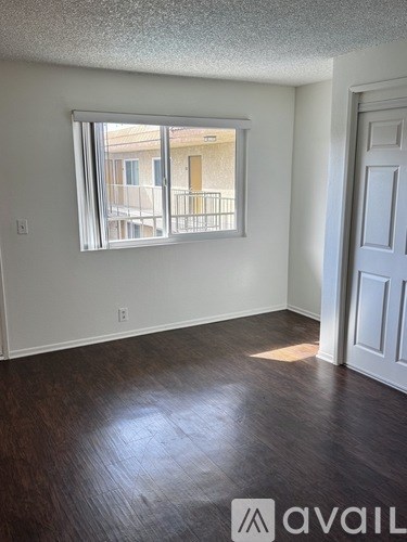 A room with a window and a door.