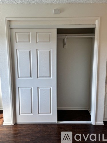A white door with a hinged panel on the left side.