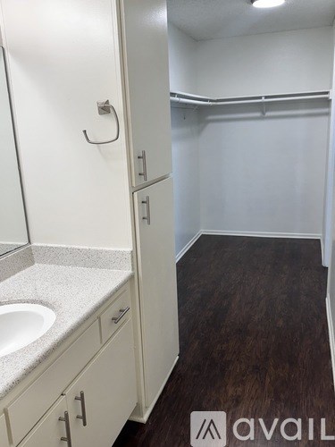 A bathroom with a sink and a toilet.