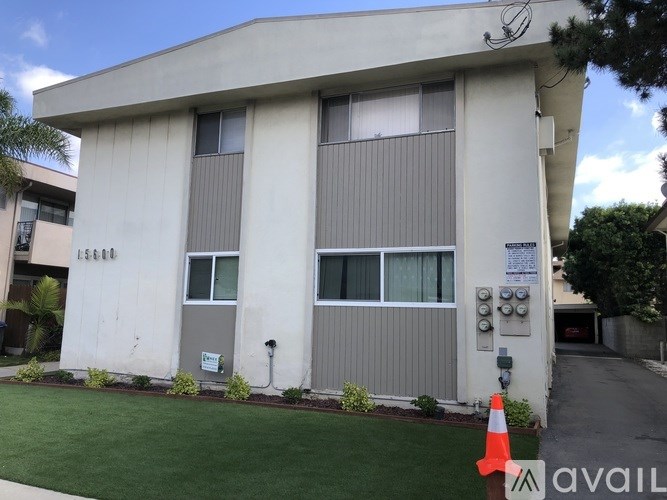 A building with a sign that says "ESCORT" on the front.