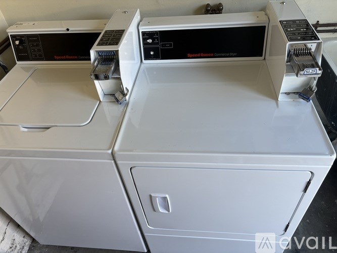 A white electronic device with a black screen and a silver handle.