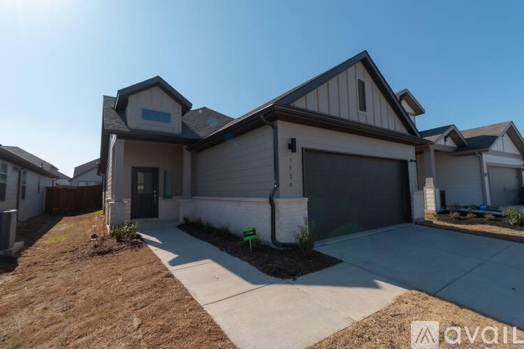 A house with a garage is available for sale.