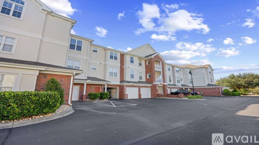 A row of townhouses with a clear blue sky above them.