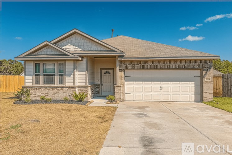 A house with a garage is for sale.