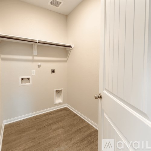 A white door is on the right side of the image.