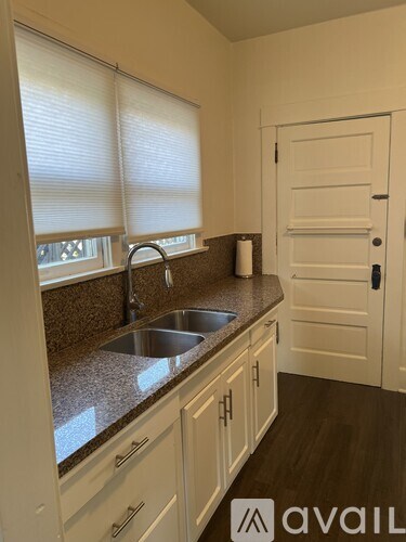 A kitchen with a sink and cabinets.