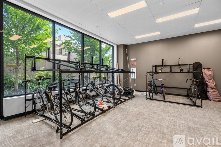 A room with a bicycle rack and a bicycle on it.