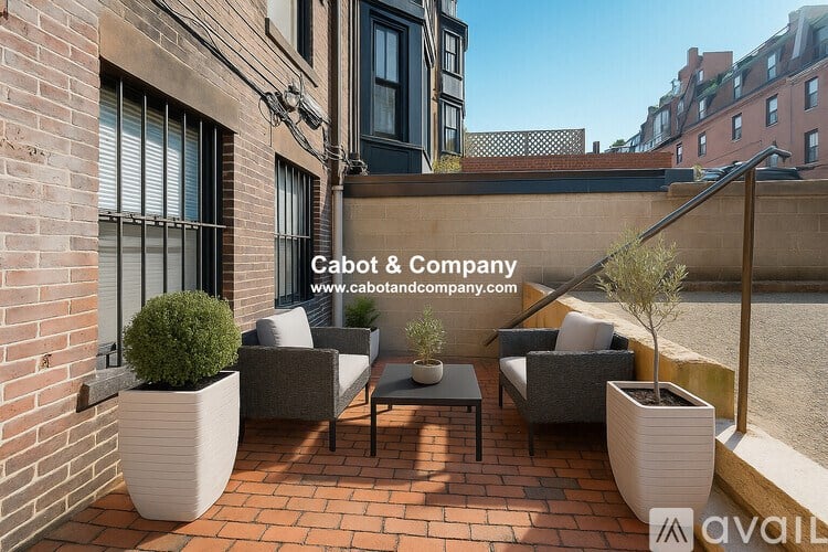 A patio with a table and chairs surrounded by potted plants.