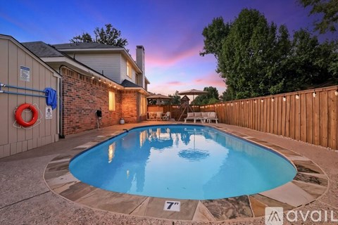 A pool with a 7 feet depth sign is in the foreground.