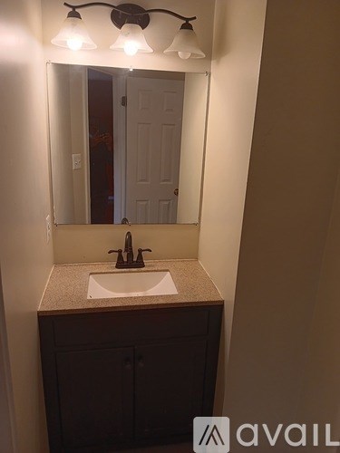 A bathroom sink with a mirror above it.