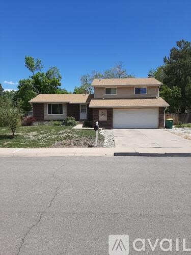 A house with a garage is for sale.