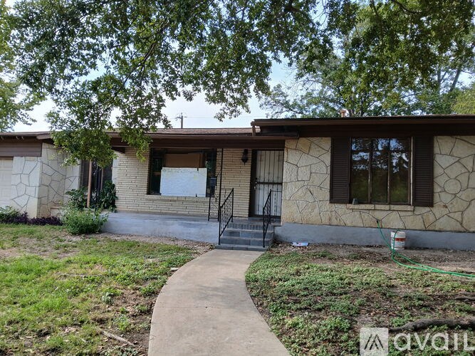 A house with a white board on the window.