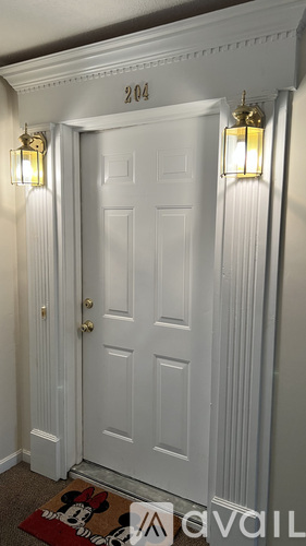 A white door with a number 204 above it.