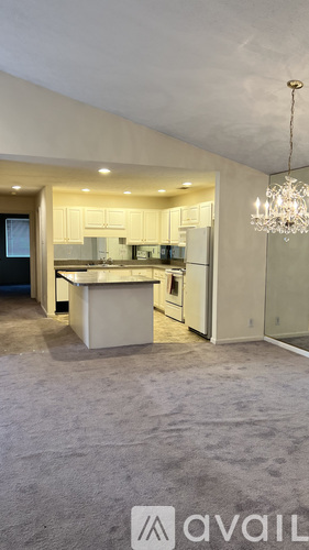 A modern kitchen with a large island in the middle.